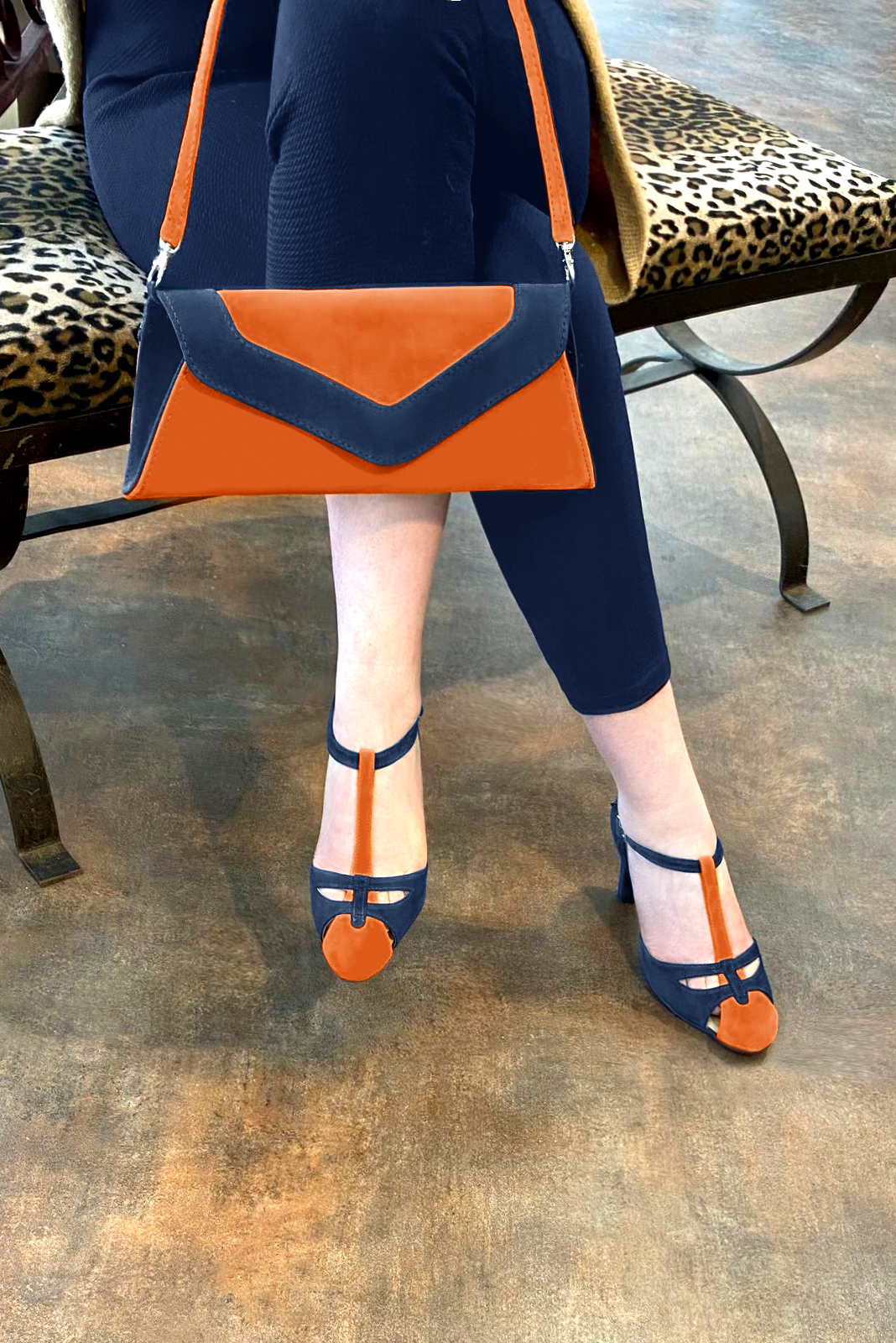 Clementine orange and navy blue women's T-strap open side shoes. Round toe. High kitten heels. Worn view - Florence KOOIJMAN